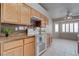 Modern kitchen with granite countertops, stainless steel appliances, and ample cabinet space for storage at 6032 Port Of Dreams Dr, Las Vegas, NV 89130