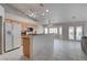 The kitchen is well-equipped with stainless steel appliances, a breakfast bar, and easy access to the dining area and backyard at 6032 Port Of Dreams Dr, Las Vegas, NV 89130