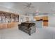 Open living room with built-in bookshelves flows into the kitchen area, creating an inviting and functional living space at 6032 Port Of Dreams Dr, Las Vegas, NV 89130