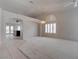 Bright living room featuring neutral paint, archways, and carpeted floor at 6032 Port Of Dreams Dr, Las Vegas, NV 89130