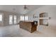 Living room featuring tile floors, a fireplace and a ceiling fan at 6032 Port Of Dreams Dr, Las Vegas, NV 89130
