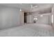 Bright living room featuring neutral paint, archways, and carpeted floor at 6032 Port Of Dreams Dr, Las Vegas, NV 89130
