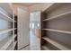 Walk-in pantry with ample shelving space for storing groceries and kitchen essentials, keeping your kitchen organized and clutter-free at 6032 Port Of Dreams Dr, Las Vegas, NV 89130