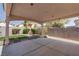 The covered patio provides shade and is perfect for enjoying the beautifully landscaped backyard of this home at 6032 Port Of Dreams Dr, Las Vegas, NV 89130