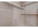 Bright walk-in closet featuring built-in shelves at 6032 Port Of Dreams Dr, Las Vegas, NV 89130