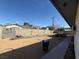 Unfinished backyard with cinder block fencing, dirt, and a concrete slab patio at 6248 Dayton Ave, Las Vegas, NV 89107