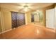 Bedroom featuring a ceiling fan, window, and mirrored wall decor at 6248 Dayton Ave, Las Vegas, NV 89107