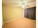 This bedroom features a ceiling fan and dark curtains for blocking out the light at 6248 Dayton Ave, Las Vegas, NV 89107