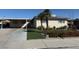 Charming single-story home with a well-manicured lawn and mature landscaping at 6248 Dayton Ave, Las Vegas, NV 89107