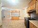 Open concept kitchen and dining area with tile floors at 6248 Dayton Ave, Las Vegas, NV 89107