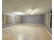 Spacious living room with tile floors and neutral walls and drapes at 6248 Dayton Ave, Las Vegas, NV 89107