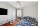 Bright bedroom with themed bedding, wood floors and ceiling fan at 6404 Extreme Shear Ave # 103, Henderson, NV 89011