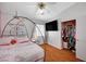 Bedroom boasts hardwood floors, a large window for natural light, and a closet at 6404 Extreme Shear Ave # 103, Henderson, NV 89011