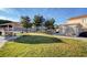 Well-maintained community park with picnic shelter and BBQ, adjacent to neighborhood residences at 6404 Extreme Shear Ave # 103, Henderson, NV 89011
