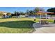 Community park featuring picnic tables, a grill, and a grassy area for outdoor activities and gatherings at 6404 Extreme Shear Ave # 103, Henderson, NV 89011