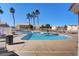 Large community pool with lounge chairs, clear blue water and shade trees for a relaxing experience at 6404 Extreme Shear Ave # 103, Henderson, NV 89011