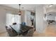 Open dining area with contemporary lighting and seamless access to the kitchen and living room at 6404 Extreme Shear Ave # 103, Henderson, NV 89011