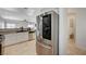 A kitchen featuring stainless steel refrigerator and decorative backsplash at 6404 Extreme Shear Ave # 103, Henderson, NV 89011