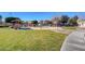 Community park showcasing a fun splash pad area, picnic benches, and lush green spaces for outdoor enjoyment at 6404 Extreme Shear Ave # 103, Henderson, NV 89011