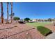 The community putting green, surrounded by trees, provides a relaxing recreational space for residents at 6404 Extreme Shear Ave # 103, Henderson, NV 89011