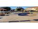 Community splash pad area with a colorful rainbow feature, picnic tables, and nearby residences at 6404 Extreme Shear Ave # 103, Henderson, NV 89011