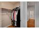 Spacious walk-in closet offers plenty of space for clothes and shoes, leading to bathroom at 6404 Extreme Shear Ave # 103, Henderson, NV 89011