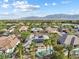 Aerial view of the property featuring a pool, solar panels and lush landscaping at 6895 Kelp Ledge Ct, Las Vegas, NV 89131