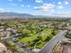 Picturesque aerial view of the neighborhood park and lush green spaces at 6895 Kelp Ledge Ct, Las Vegas, NV 89131