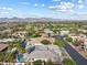 Breathtaking aerial view showcasing lush landscaping, sparkling pools, and well-maintained homes in the community at 6895 Kelp Ledge Ct, Las Vegas, NV 89131