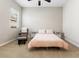 Cozy bedroom featuring neutral tones, plush carpeting, and a comfortable seating area at 6895 Kelp Ledge Ct, Las Vegas, NV 89131