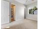 Bedroom with large window, closet and two doorways leading to other rooms at 6895 Kelp Ledge Ct, Las Vegas, NV 89131