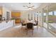 Bright dining area featuring tile floors, natural light from windows, and access to the outdoor patio at 6895 Kelp Ledge Ct, Las Vegas, NV 89131