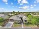 Beautiful single-story home with a well-manicured lawn, desert landscaping and mature trees at 6895 Kelp Ledge Ct, Las Vegas, NV 89131