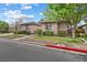 Well-maintained front yard featuring lush landscaping, mature trees, and a manicured lawn at 6895 Kelp Ledge Ct, Las Vegas, NV 89131