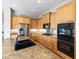Well-equipped kitchen with granite countertops, stainless steel appliances, and ample cabinet space at 6895 Kelp Ledge Ct, Las Vegas, NV 89131