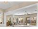 Bright living room featuring a ceiling fan, recessed lighting and windows providing natural light at 6895 Kelp Ledge Ct, Las Vegas, NV 89131