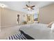 Spacious main bedroom with carpet, ceiling fan, and private outdoor access at 6895 Kelp Ledge Ct, Las Vegas, NV 89131