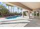Beautiful backyard pool with an expansive patio and tall palm trees at 6895 Kelp Ledge Ct, Las Vegas, NV 89131