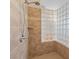 Shower stall featuring glass block accent wall and a chrome shower head at 6895 Kelp Ledge Ct, Las Vegas, NV 89131