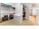 Large walk-in closet with multiple shelves and storage, plus an additional dresser at 6895 Kelp Ledge Ct, Las Vegas, NV 89131