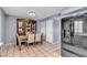 Traditional dining room with tile floors, built in cabinet, and seating for four at 7030 Burcot Ave # D106, Las Vegas, NV 89156