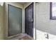 Close-up of the exterior entrance, featuring a security door, handle and painted front door at 7030 Burcot Ave # D106, Las Vegas, NV 89156