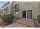 Inviting condo entrance featuring security door, and quaint balcony in a tidy, well-maintained community at 7030 Burcot Ave # D106, Las Vegas, NV 89156