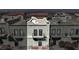 Three-story townhouse featuring a small balcony, stucco walls and rooftop deck at 7030 Burcot Ave # D106, Las Vegas, NV 89156