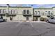 View of condo parking, showcasing neat rows and ample parking spaces and building design at 7030 Burcot Ave # D106, Las Vegas, NV 89156