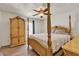 Main bedroom showcases a four poster bed frame and matching dresser at 7030 Burcot Ave # D106, Las Vegas, NV 89156