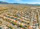 An aerial view shows the property located in a well-maintained neighborhood with desert landscaping and mountain views at 7033 Red Tide Dr, Las Vegas, NV 89131