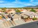 An aerial view showcases a single-story home with desert landscaping and solar panels in a residential neighborhood at 7033 Red Tide Dr, Las Vegas, NV 89131