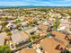 A charming residential area is displayed, with backyard pools and solar panels, nestled in a well-established neighborhood at 7033 Red Tide Dr, Las Vegas, NV 89131