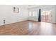 Bright bedroom with laminate wood floors, bay windows and access to an outdoor patio at 7033 Red Tide Dr, Las Vegas, NV 89131